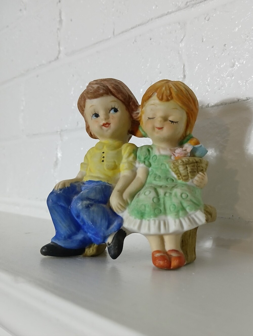 Young Boy and Girl Sitting on a Bench, Ceramic Figurine -